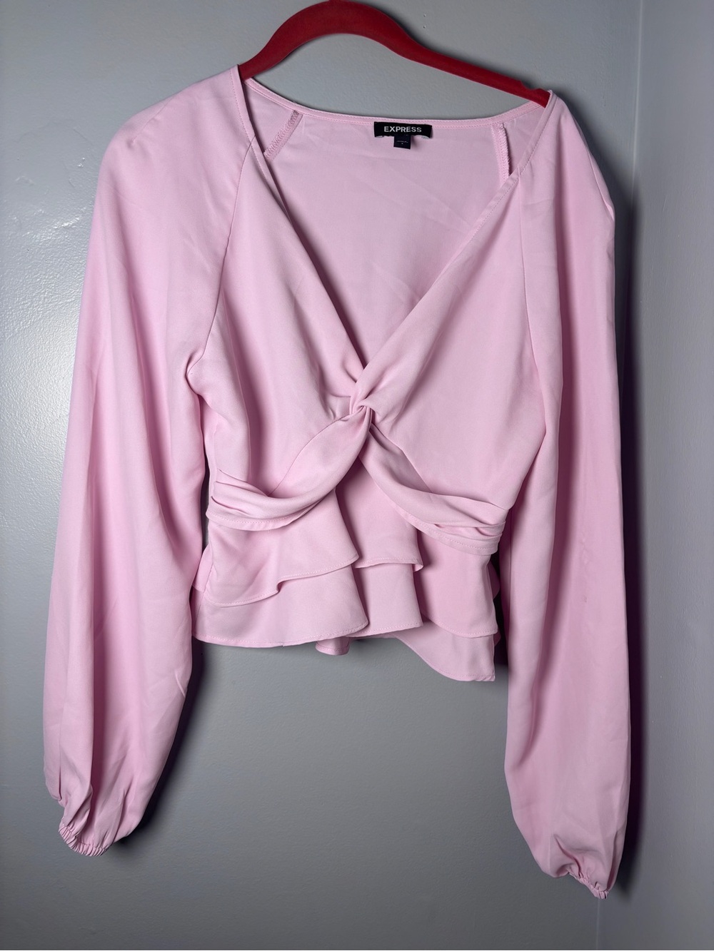 Pink Express long sleeve blouse with ruffled bottom size Small
